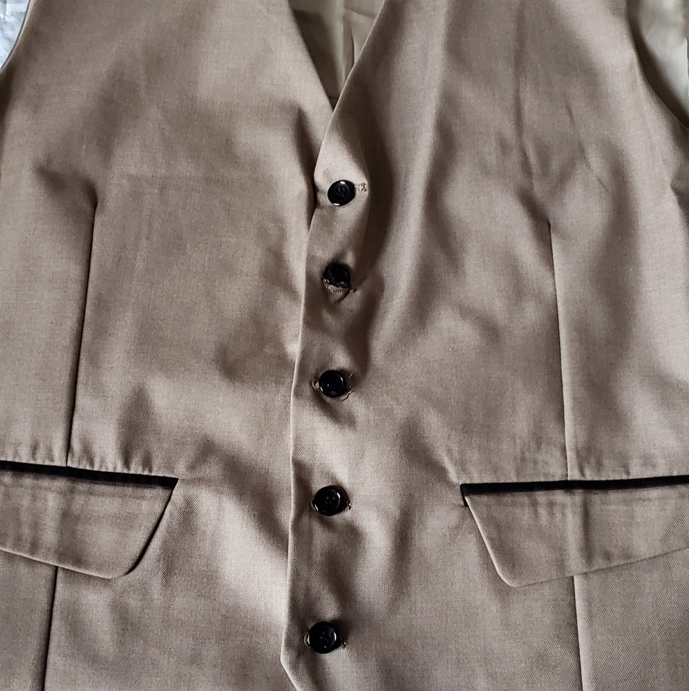 Five button, high breasted vest.